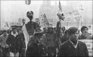 March for Peace, Detroit, Nov. 5, 1966: Detroit-Amsterdam Committee with masks, helmets, and puppets