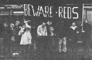 March for Peace, Detroit, Nov. 5, 1966: Local anti-peace group, Breakthrough. A group of 9 with banner reading "Beware of Reds."